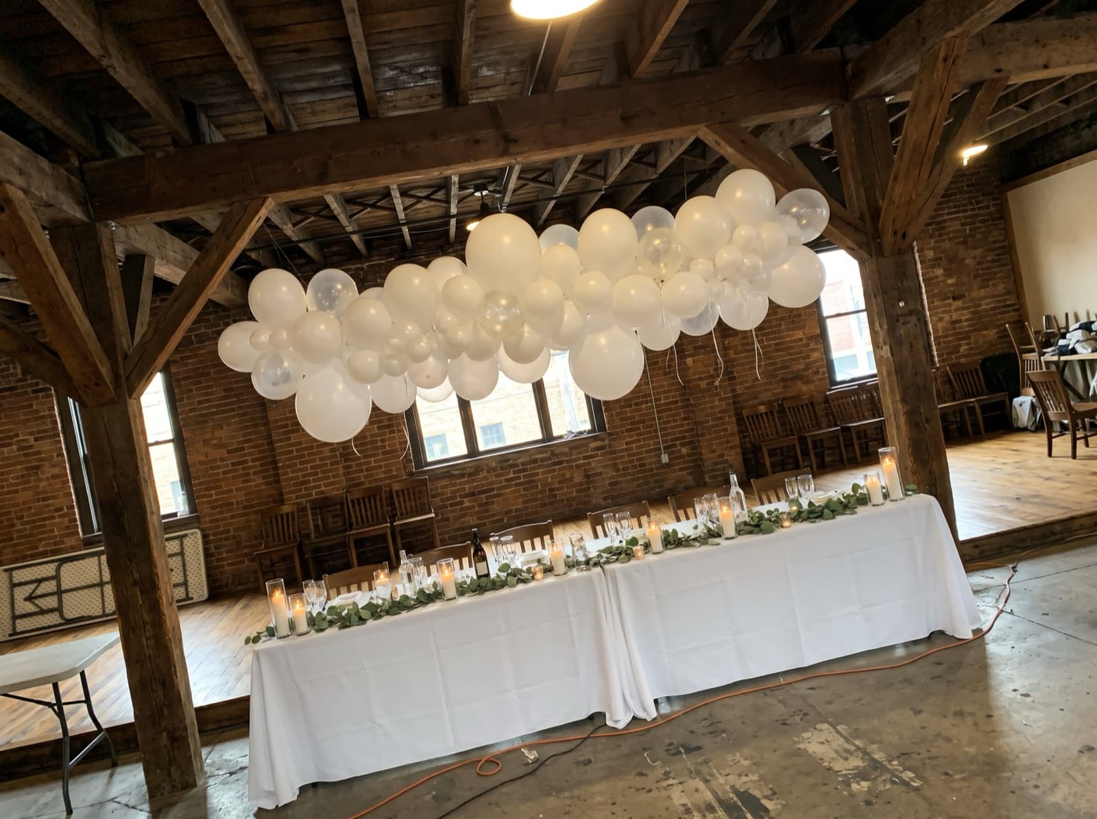 Balloon cloud over a sweetheart table