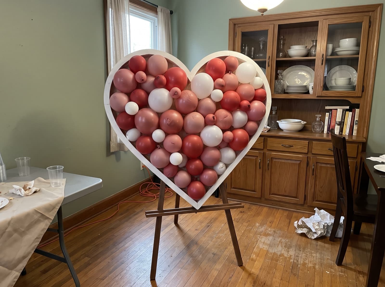 Heart-shaped balloon mosaic in red, pink and white