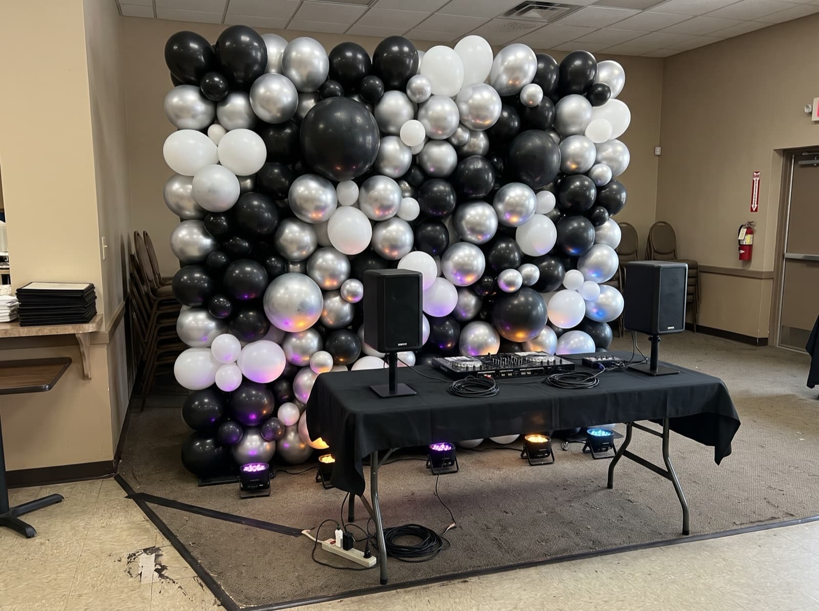 Balloon wall behind a DJ table