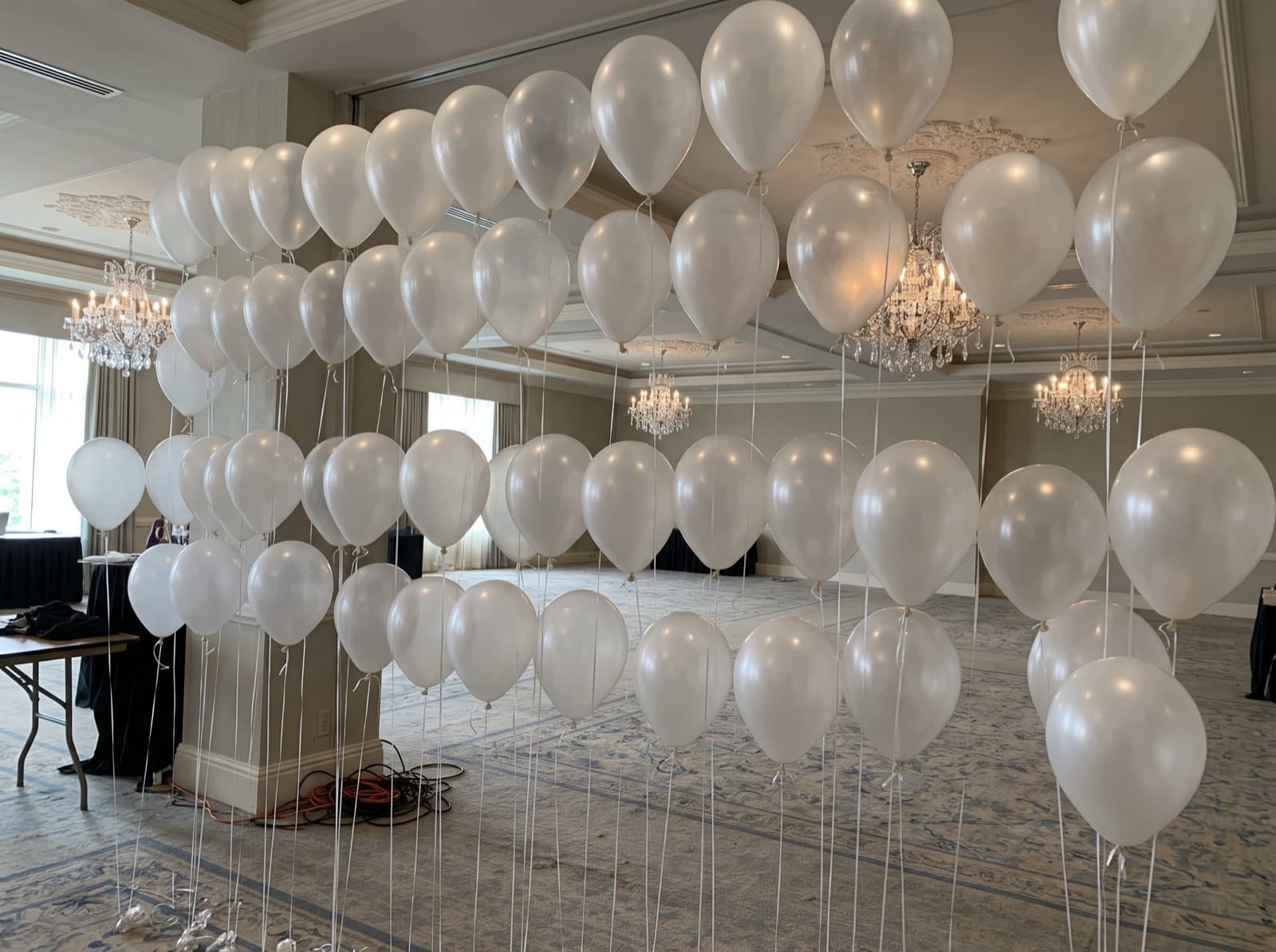 Floating helium balloon wall with ribbons